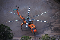 Erickson Aircrane Sikorsky 64 dipping into a muddy pond in Florida